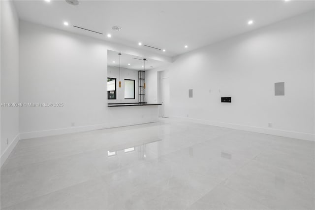 interior space featuring recessed lighting and baseboards