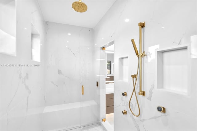 bathroom with a marble finish shower