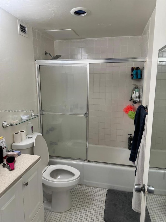 full bathroom featuring enclosed tub / shower combo and tile floors