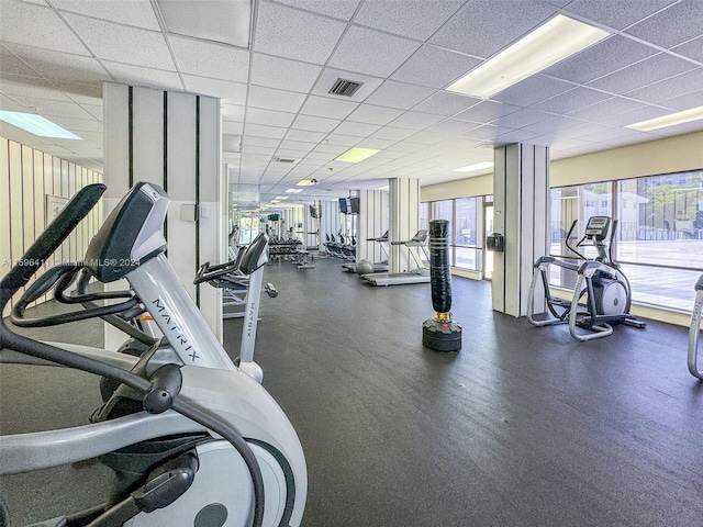 gym featuring a drop ceiling