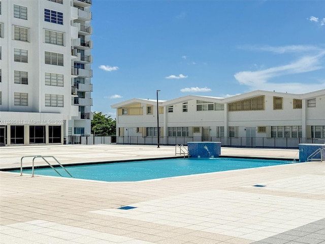 view of pool featuring a patio and pool water feature