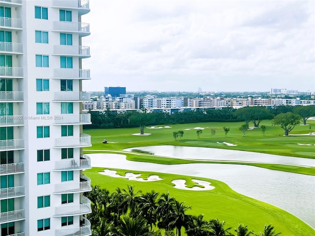 surrounding community featuring a water view and a yard