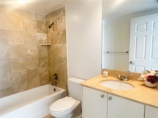 full bathroom with vanity, toilet, and tiled shower / bath combo