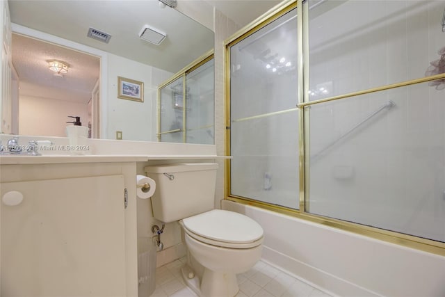 full bathroom featuring tile flooring, combined bath / shower with glass door, a textured ceiling, toilet, and vanity