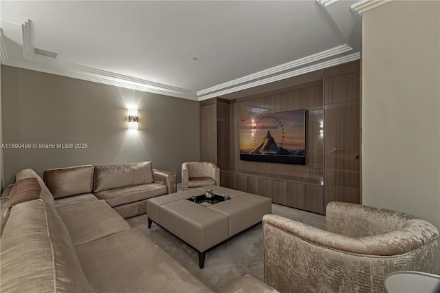 carpeted home theater room with crown molding