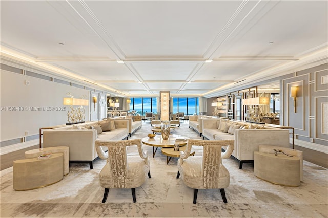 living room with ornamental molding and coffered ceiling