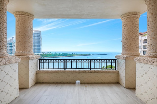 balcony featuring a water view