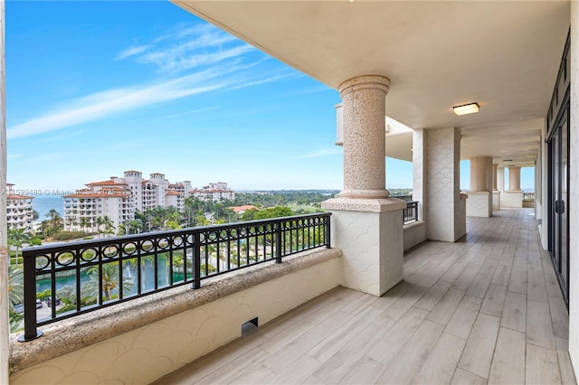 balcony featuring a water view