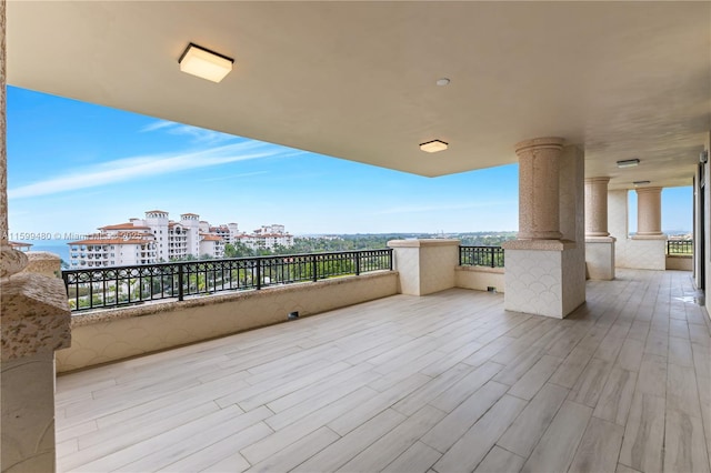 view of patio featuring a balcony