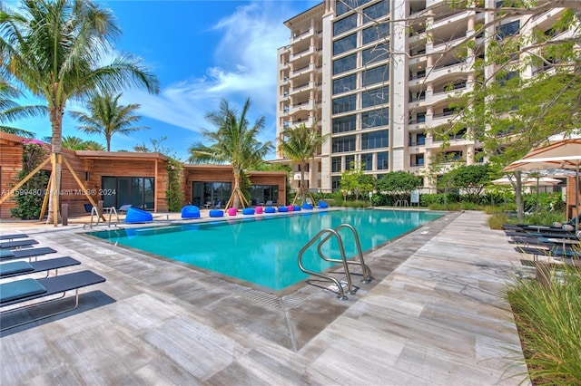 view of swimming pool featuring a patio area