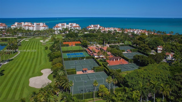 bird's eye view featuring a water view and view of golf course