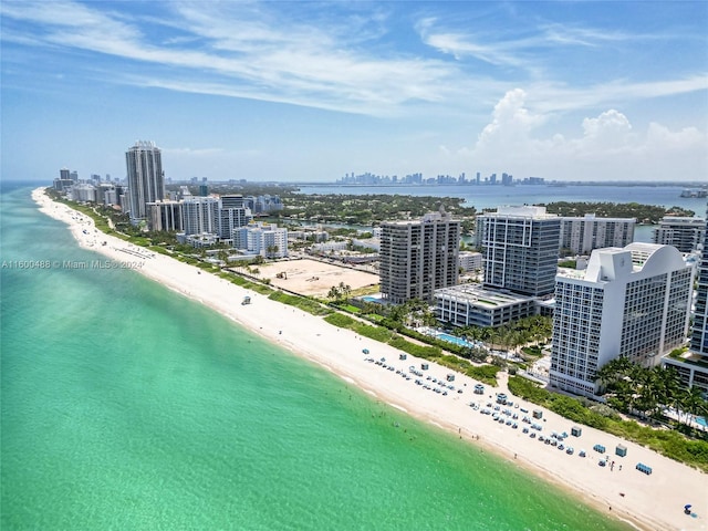 birds eye view of property featuring a view of the beach and a water view