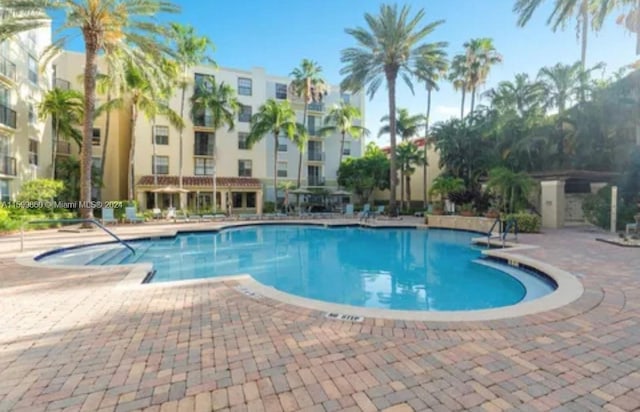 view of swimming pool with a patio