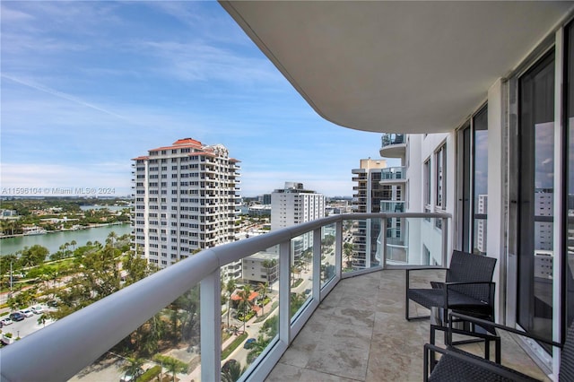 balcony featuring a water view