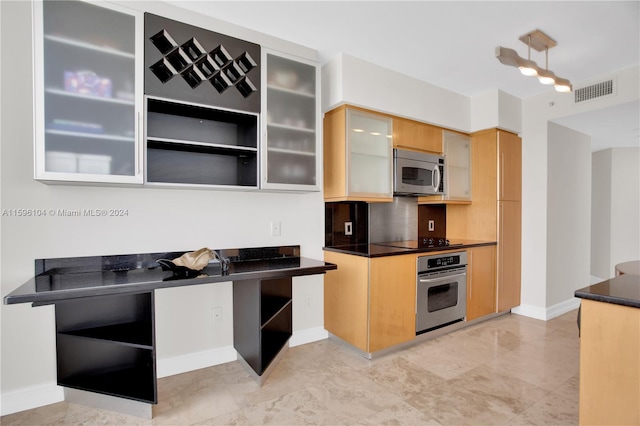 kitchen featuring decorative backsplash and stainless steel appliances