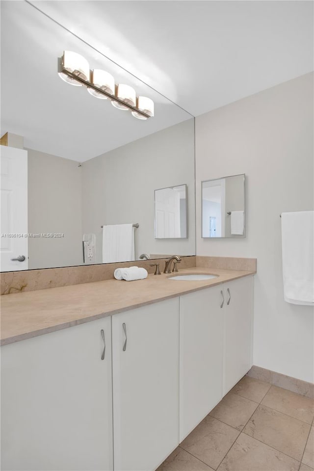 bathroom with vanity and tile patterned flooring