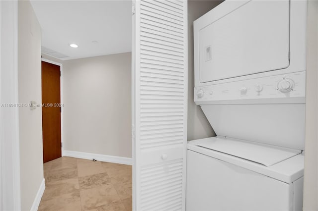 laundry room featuring stacked washing maching and dryer