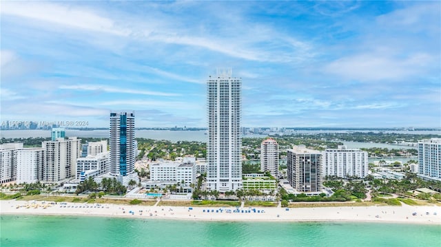 bird's eye view featuring a beach view and a water view