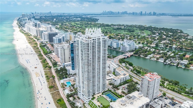 aerial view with a water view and a view of the beach