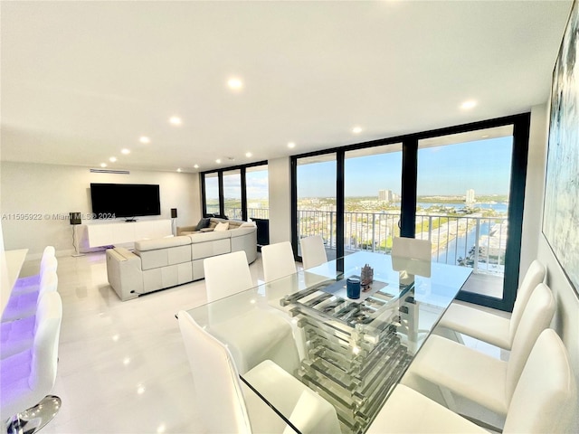 dining space with a wall of windows