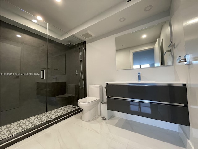 bathroom with vanity, toilet, and a shower with door