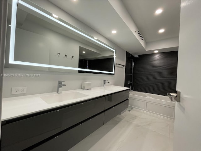 bathroom with vanity and bathing tub / shower combination