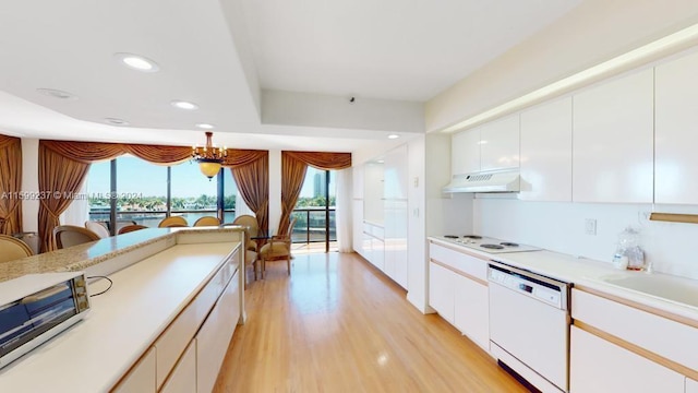 kitchen featuring white cabinetry, white appliances, and light wood-type flooring