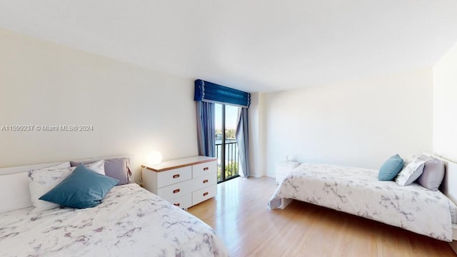 bedroom with light hardwood / wood-style flooring