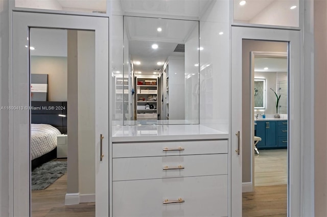 walk in closet featuring light hardwood / wood-style flooring