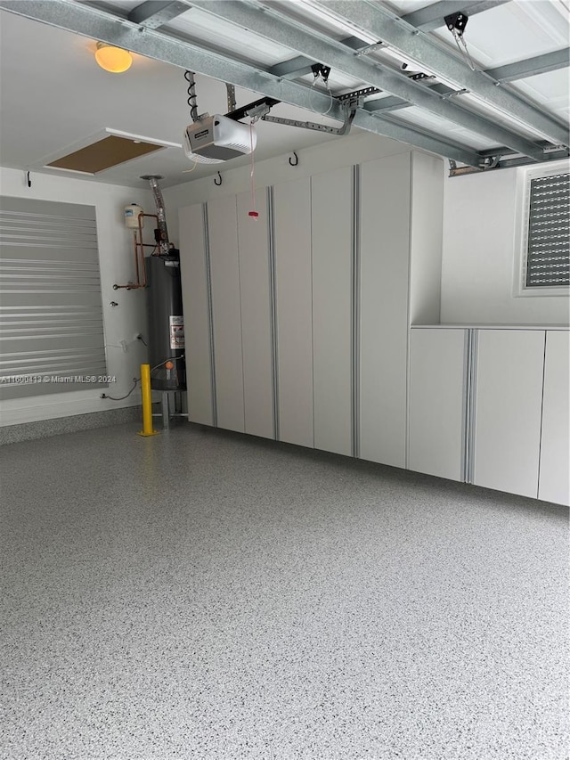 garage with a garage door opener and water heater