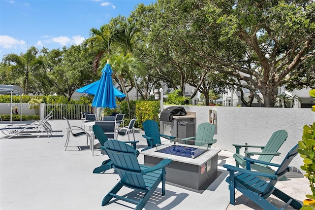 view of patio / terrace with a fire pit