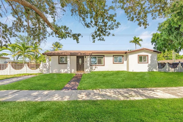 ranch-style house featuring a front lawn