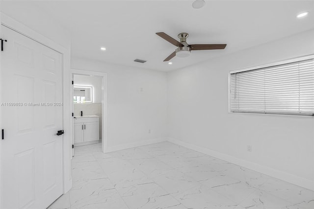 empty room featuring ceiling fan