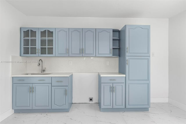 kitchen featuring decorative backsplash and sink