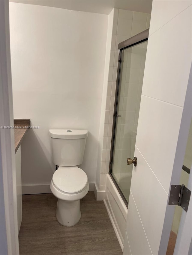 bathroom featuring toilet and hardwood / wood-style floors