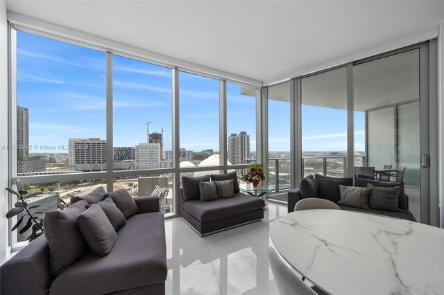 tiled living room with a wealth of natural light and expansive windows