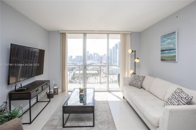 living area with tile patterned floors and expansive windows