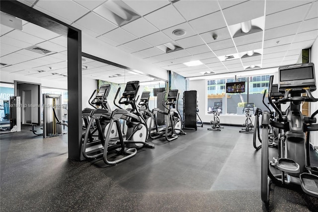 workout area featuring visible vents and a drop ceiling