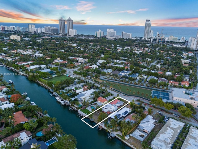 aerial view at dusk with a water view