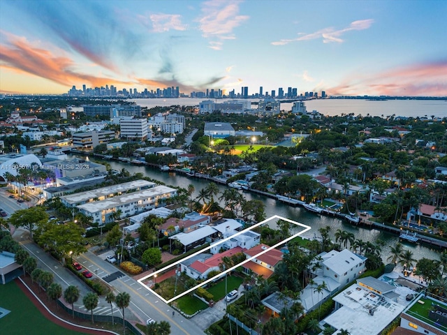 aerial view at dusk with a water view