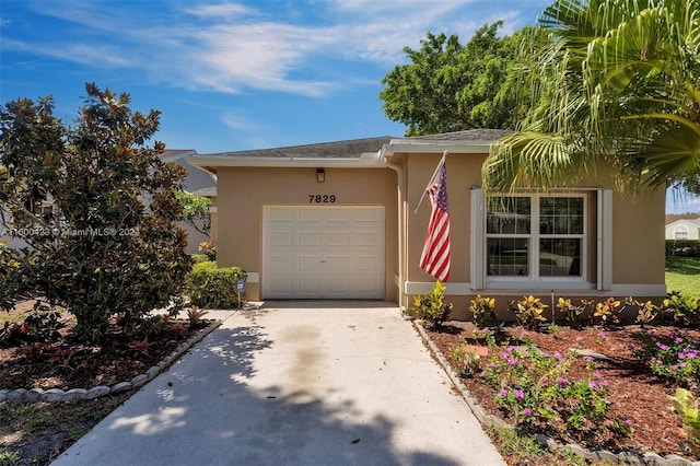 single story home featuring a garage