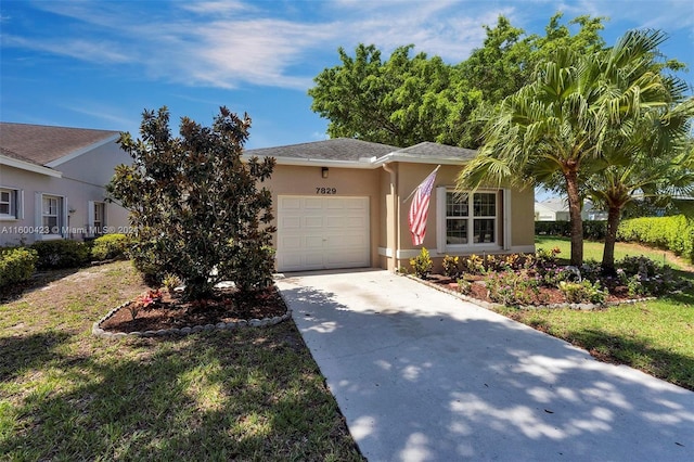 ranch-style home with a front yard and a garage