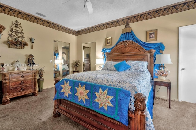 bedroom with carpet, ceiling fan, a textured ceiling, and a closet