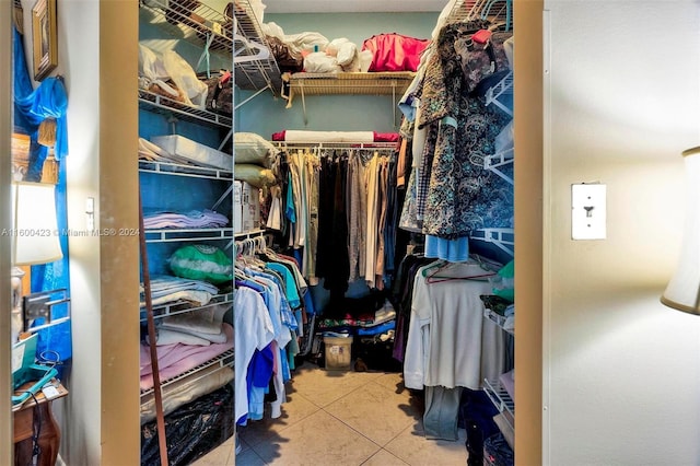 walk in closet with tile patterned floors