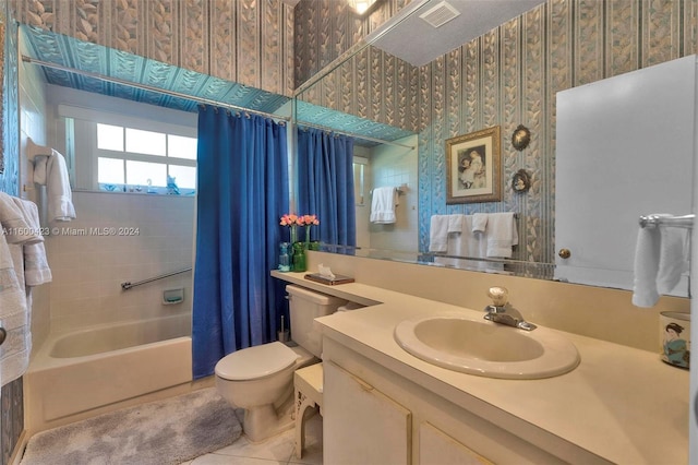 full bathroom with toilet, tile patterned flooring, vanity, and shower / tub combo with curtain