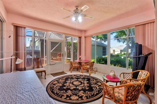 sunroom / solarium with ceiling fan