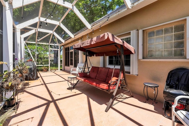 view of patio / terrace with glass enclosure