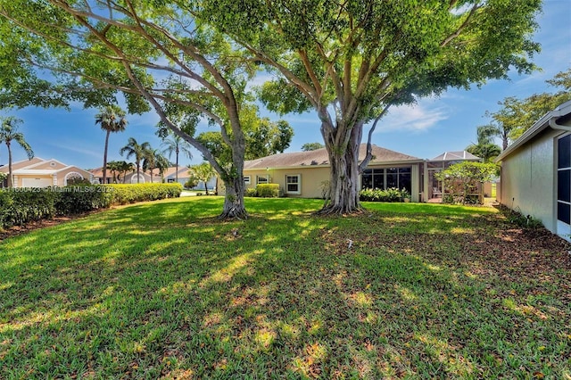 view of yard with a lanai