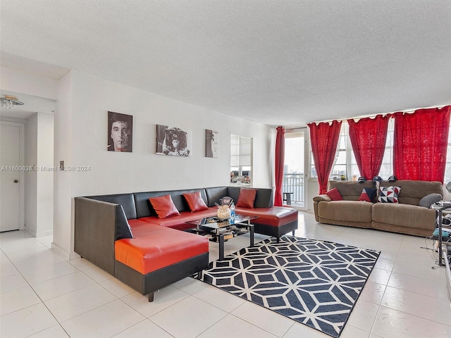 living room featuring tile patterned floors and a textured ceiling