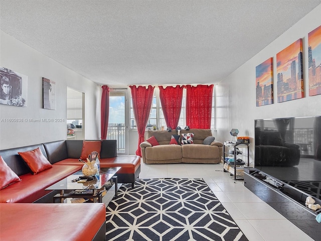 living room with tile patterned flooring and a textured ceiling